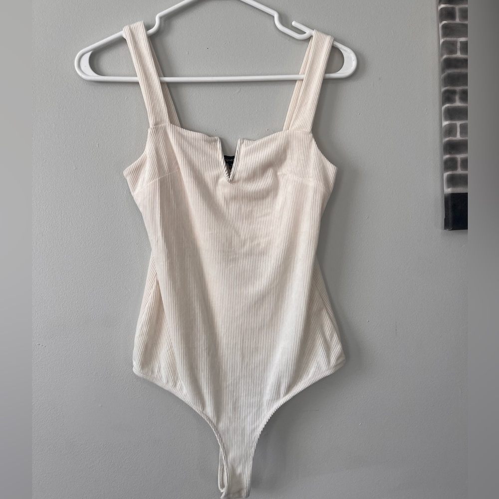 Off white ribbed body suit.